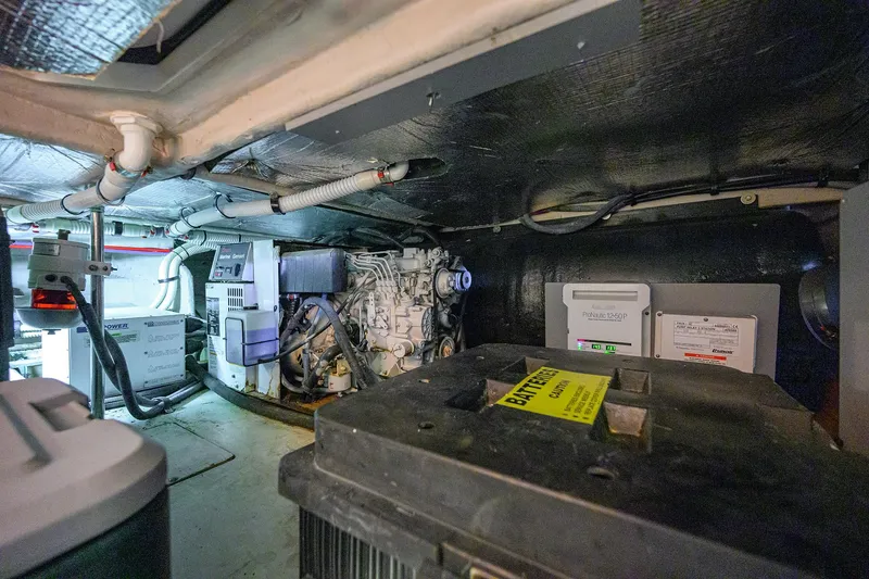 Slide: The Image of Engine room of 2005 Sea Ray 52 Sedan Bridge yacht, showcasing machinery and equipment. - 38