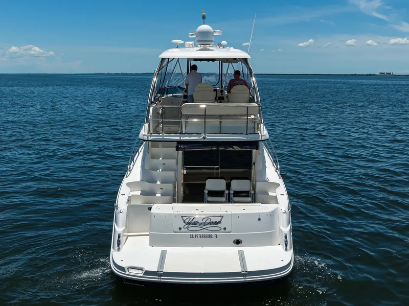 Slide: The Image of 2005 Sea Ray 52 Sedan Bridge yacht cruising on open water. - 40