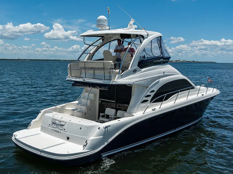 Slide: The Image of 2005 Sea Ray 52 Sedan Bridge yacht cruising on a sunny day. - 41