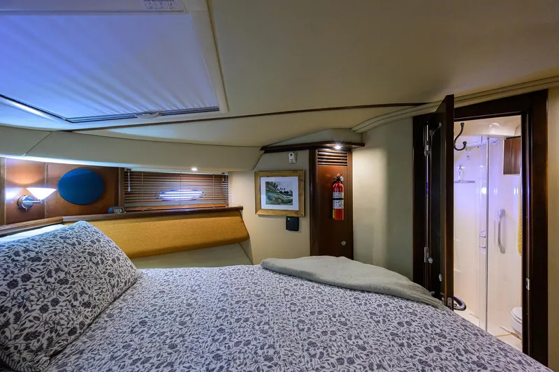 Slide: The Image of Luxurious 2005 Sea Ray 52 Sedan Bridge cabin with cozy bed and private bathroom. - 9