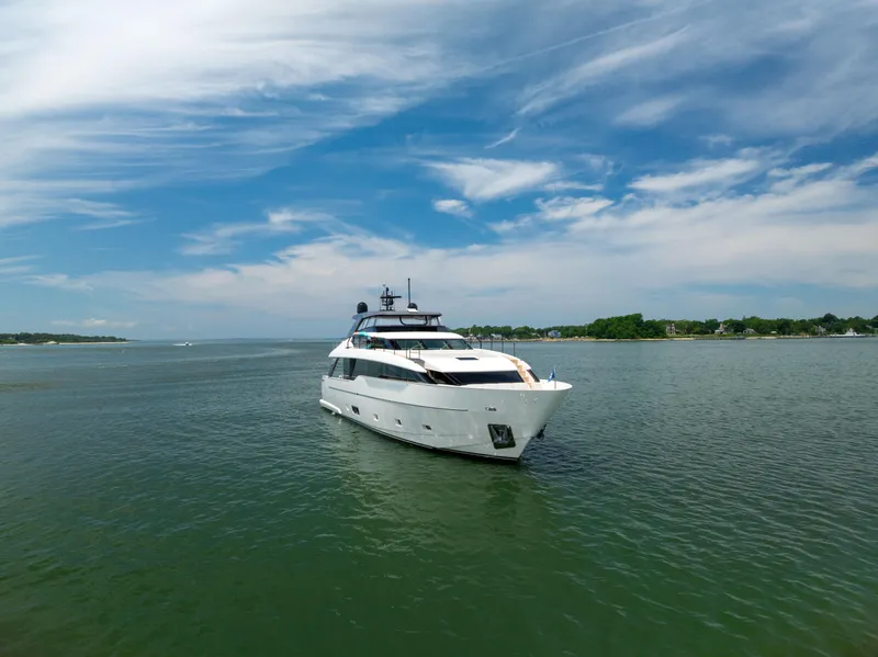 Slide: The Image of 2024 Sanlorenzo SL90A yacht cruising on a serene waterway under a clear blue sky. - 10