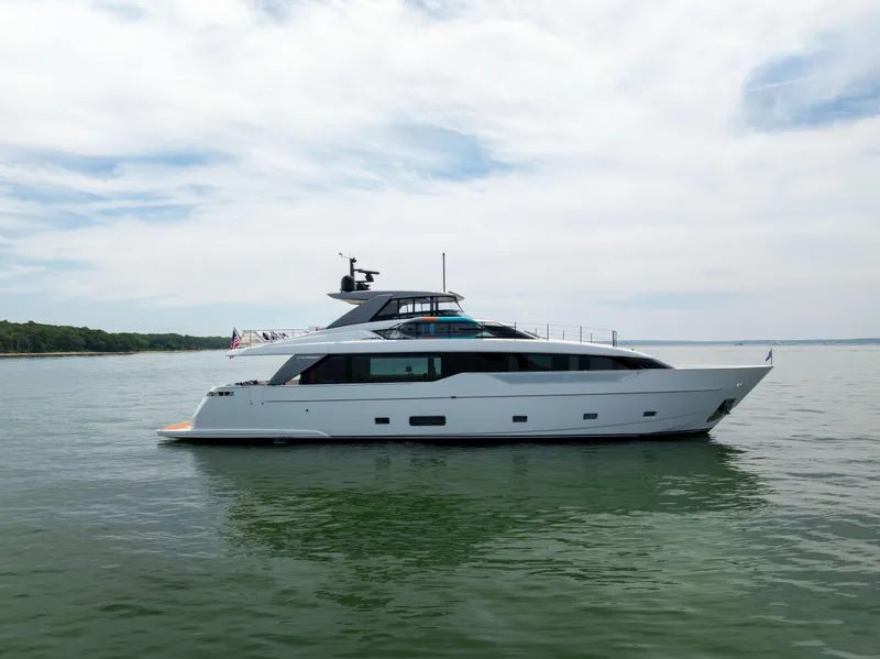 Slide: The Image of 2024 Sanlorenzo SL90A yacht on calm water under a cloudy sky. - 14