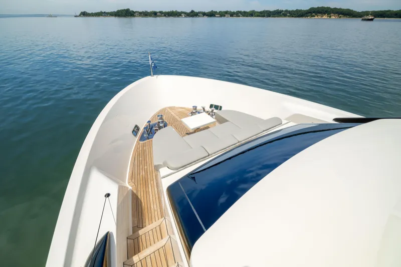 Slide: The Image of 2024 Sanlorenzo SL90A yacht deck with sun loungers on calm water. - 18