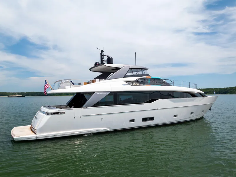 Slide: The Image of 2024 Sanlorenzo SL90A yacht on calm water under a blue sky. - 2