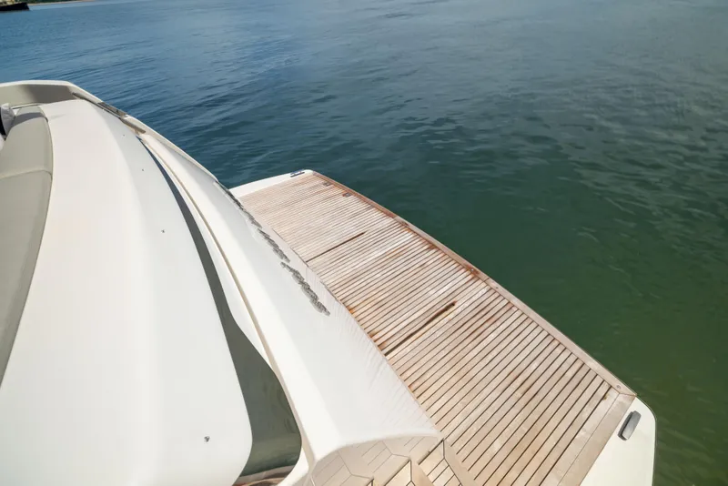 Slide: The Image of 2024 Sanlorenzo SL90A yacht with sleek deck design on calm water. - 20