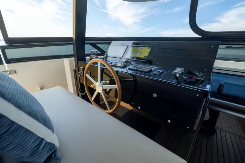 Slide: The Image of Helm of 2024 Sanlorenzo SL90A yacht with modern navigation equipment and wooden steering wheel. - 29