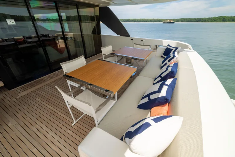 Slide: The Image of Luxurious 2024 Sanlorenzo SL90A yacht deck with elegant seating and scenic water view. - 43