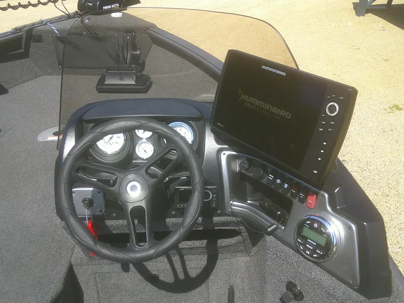 Slide: The Image of 2020 Lund 1875 Impact SS boat dashboard with steering wheel and Humminbird fish finder. - 10