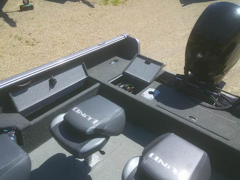 Slide: The Image of 2020 Lund 1875 Impact SS boat interior with seating and storage compartments. - 15
