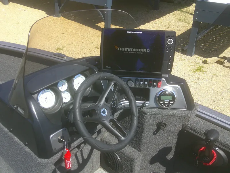 Slide: The Image of 2020 Lund 1875 Impact SS boat dashboard with Humminbird fish finder and steering wheel. - 9