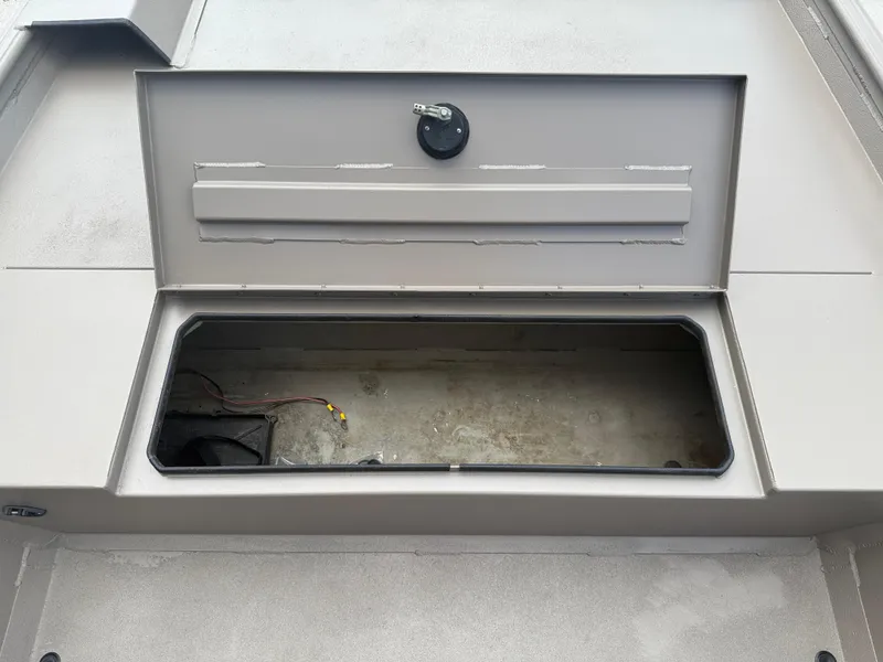 Slide: The Image of Open storage compartment on a 2018 Alweld 1752 Marsh Series boat. - 10