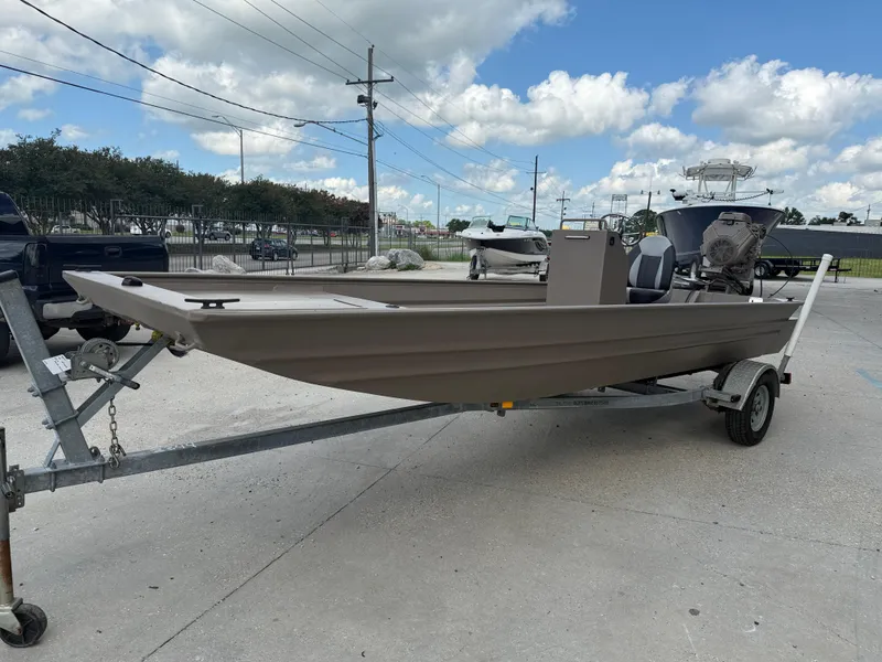 Slide: The Image of 2018 Alweld 1752 Marsh Series boat on trailer under a cloudy sky. - 4