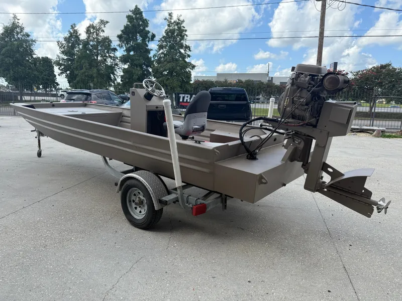 Slide: The Image of 2018 Alweld 1752 Marsh Series boat on trailer, parked outdoors under blue sky. - 5