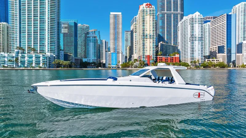 The Image of 2023 Cigarette 42 Auroris boat cruising near city skyline. - 0
