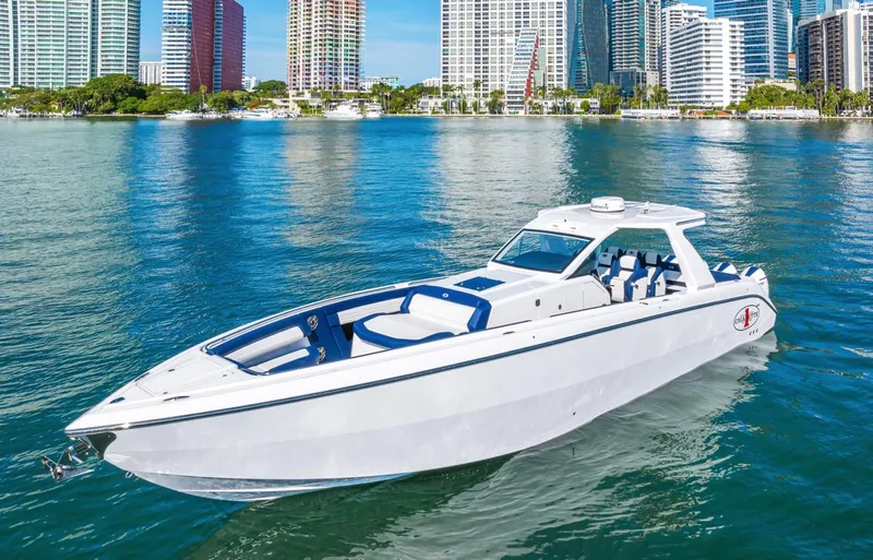 Slide: The Image of 2023 Cigarette 42 Auroris boat on water with city skyline background. - 1
