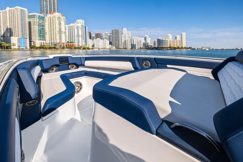 Slide: The Image of Luxurious 2023 Cigarette 42 Auroris boat with city skyline in the background. - 11
