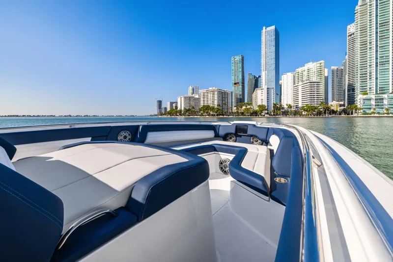 Slide: The Image of 2023 Cigarette 42 Auroris boat cruising near city skyline on a sunny day. - 12