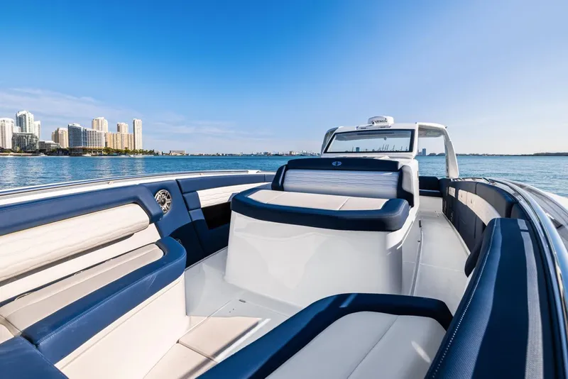 Slide: The Image of 2023 Cigarette 42 Auroris luxury boat on calm water with city skyline. - 14