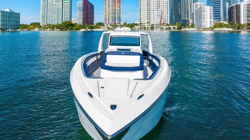 Slide: The Image of 2023 Cigarette 42 Auroris boat on water with city skyline background. - 9