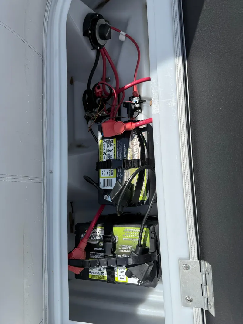 Slide: The Image of Battery compartment of 2024 Godfrey SWEETWATER 2286 SB with wiring and connections. - 10