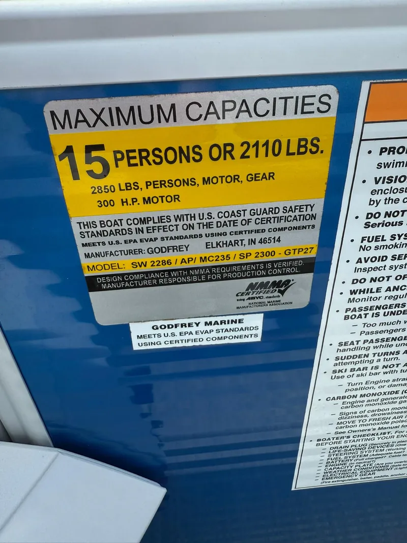 Slide: The Image of Capacity label on 2024 Godfrey SWEETWATER 2286 SB, 15 persons or 2110 lbs, 300 HP motor. - 11