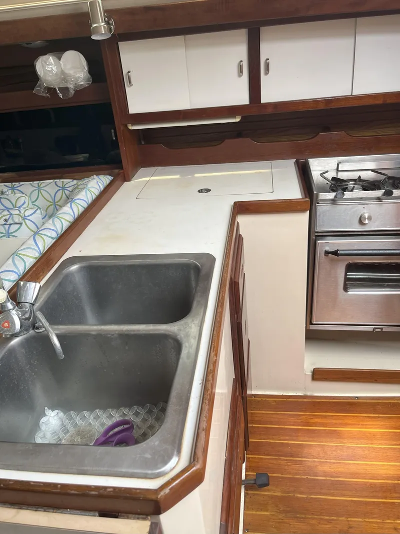 Slide: The Image of Galley kitchen in 1989 Catalina 34 MkII sailboat with sink and stove. - 12