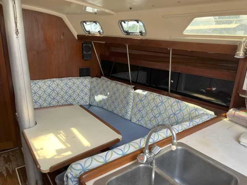Slide: The Image of Interior of 1989 Catalina 34 MkII sailboat with cozy seating and dining area. - 7