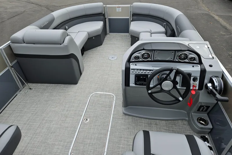 Slide: The Image of 2023 South Bay S224 UL TRIPLE pontoon boat interior with modern seating and control console. - 11