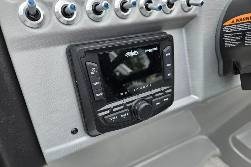 Slide: The Image of 2023 South Bay S224 UL TRIPLE boat dashboard with Wet Sounds audio system. - 13