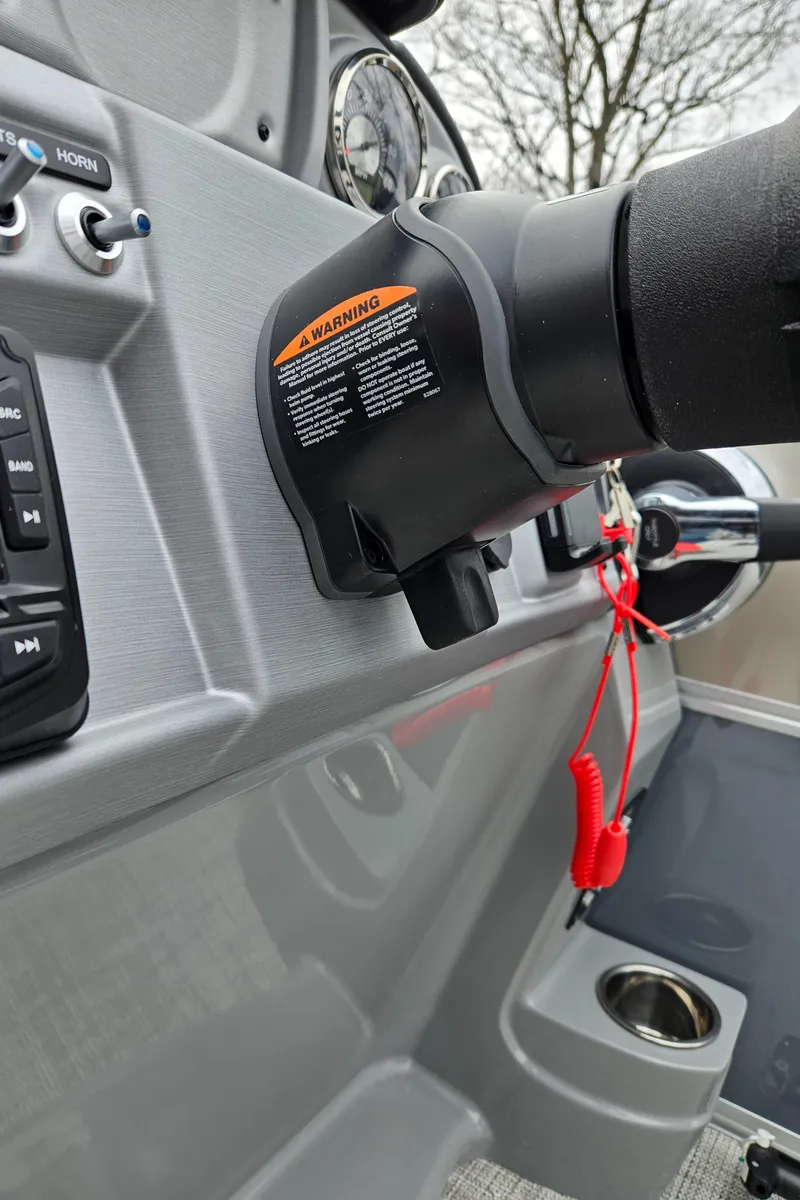 Slide: The Image of 2023 South Bay S224 UL TRIPLE boat dashboard with steering wheel and controls. - 15