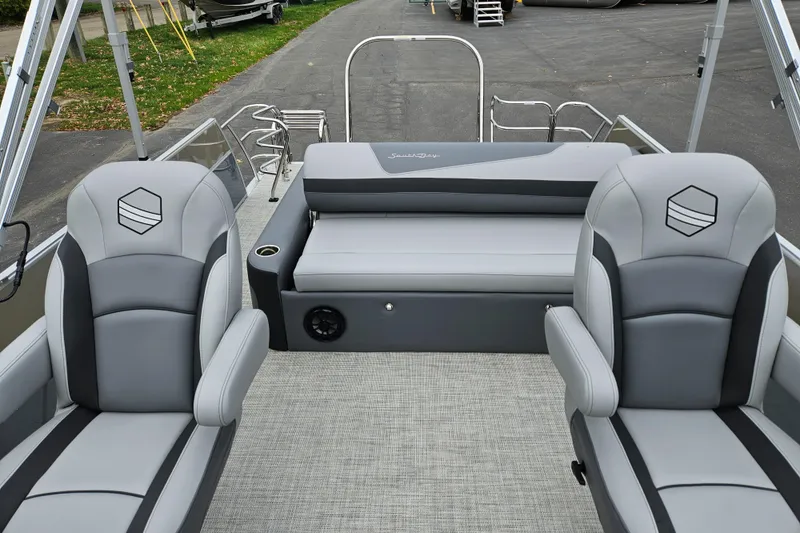 Slide: The Image of 2023 South Bay S224 UL TRIPLE pontoon boat interior with gray seating and flooring. - 16