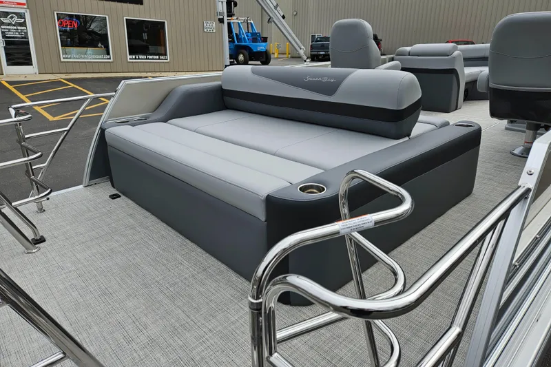 Slide: The Image of 2023 South Bay S224 UL TRIPLE pontoon boat with gray seating and stainless steel railings. - 17