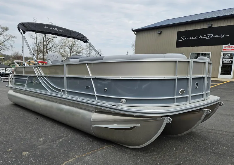 Slide: The Image of 2023 South Bay S224 UL TRIPLE pontoon boat displayed outdoors. - 5