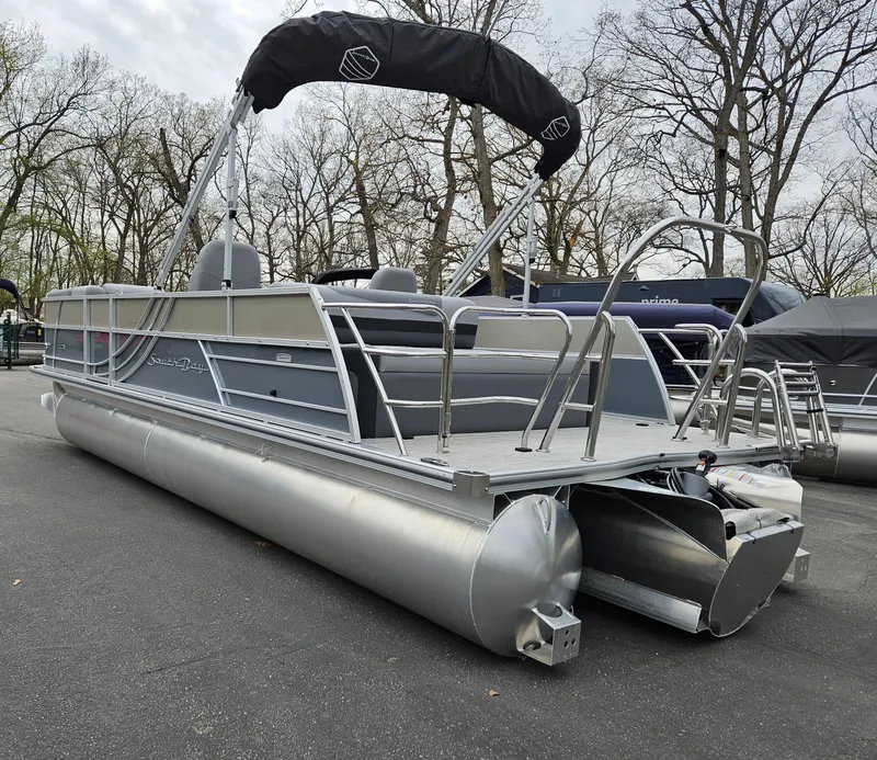 Slide: The Image of 2023 South Bay S224 UL TRIPLE pontoon boat with canopy, parked on asphalt. - 6