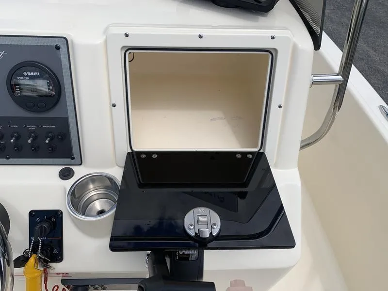Slide: The Image of 2019 Scout 175 Sportfish console with Yamaha controls and storage compartment. - 15
