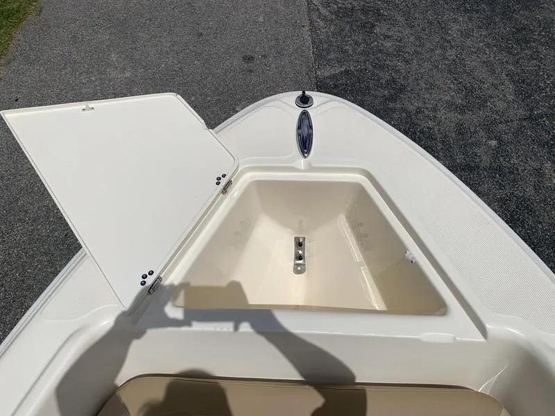 Slide: The Image of Open storage compartment on 2019 Scout 175 Sportfish boat, showing interior details. - 20