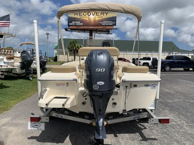 Slide: The Image of 2019 Scout 175 Sportfish boat with Yamaha 90 engine, parked outdoors. - 3