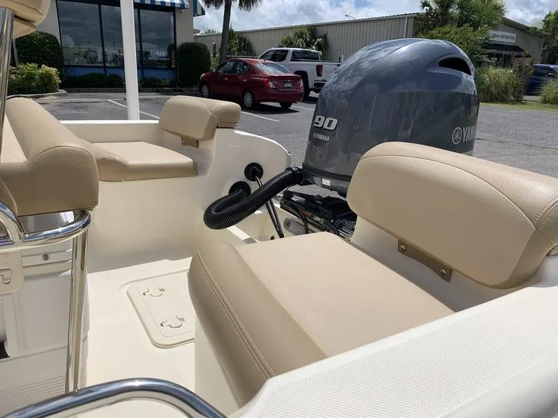 Slide: The Image of 2019 Scout 175 Sportfish boat interior with Yamaha 90 engine, beige seating. - 9