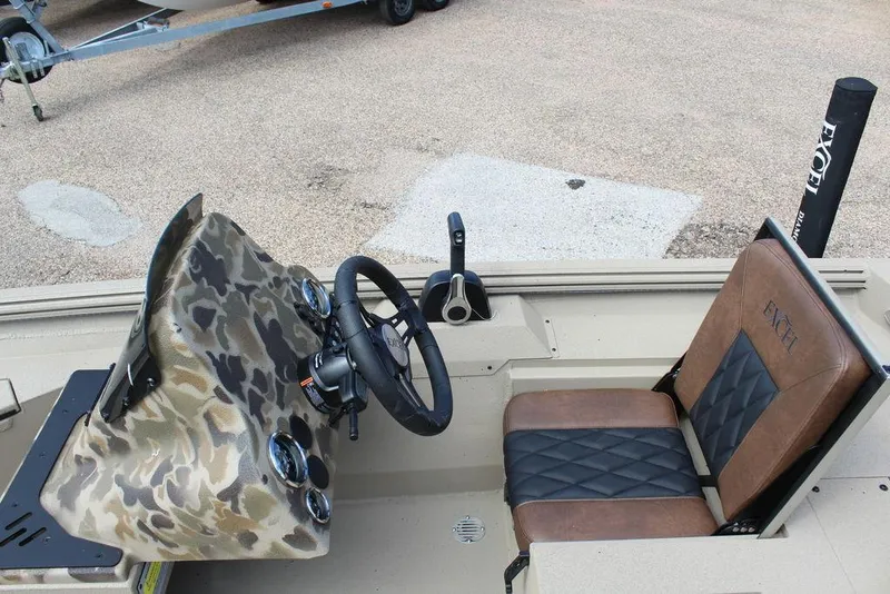 Slide: The Image of Interior of 2026 Excel Bolt 183 boat with camo dashboard and leather seat. - 10