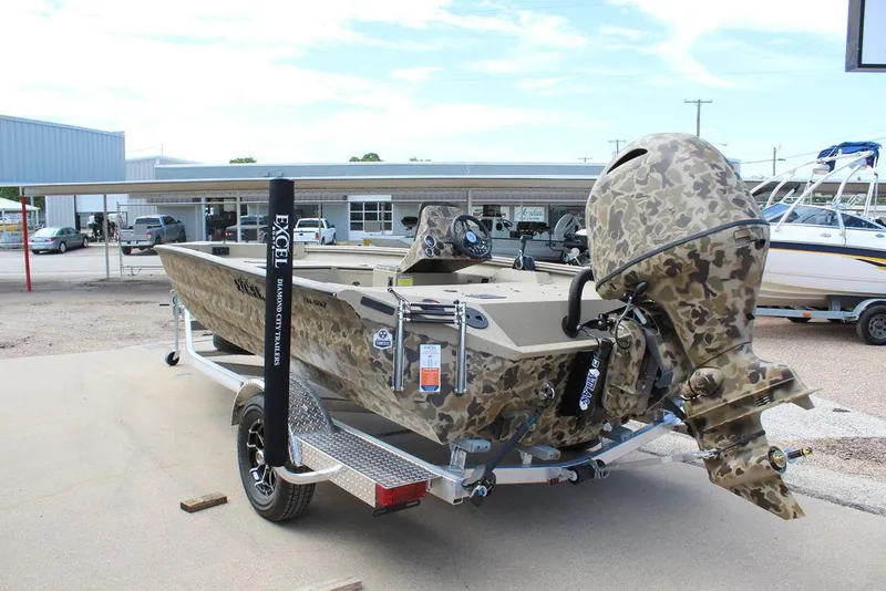 Slide: The Image of 2026 Excel Bolt 183 boat with camouflage design on a trailer in a dealership lot. - 16