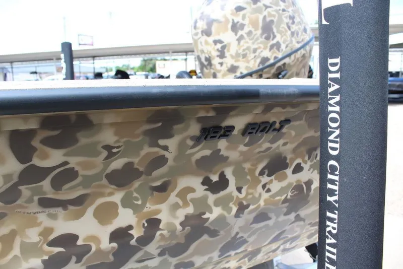 Slide: The Image of Camouflage-patterned 2026 Excel Bolt 183 boat on Diamond City trailer. - 17