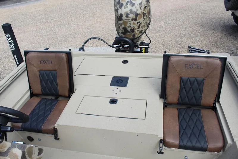 Slide: The Image of 2026 Excel Bolt 183 boat interior with brown and black leather seats. - 4