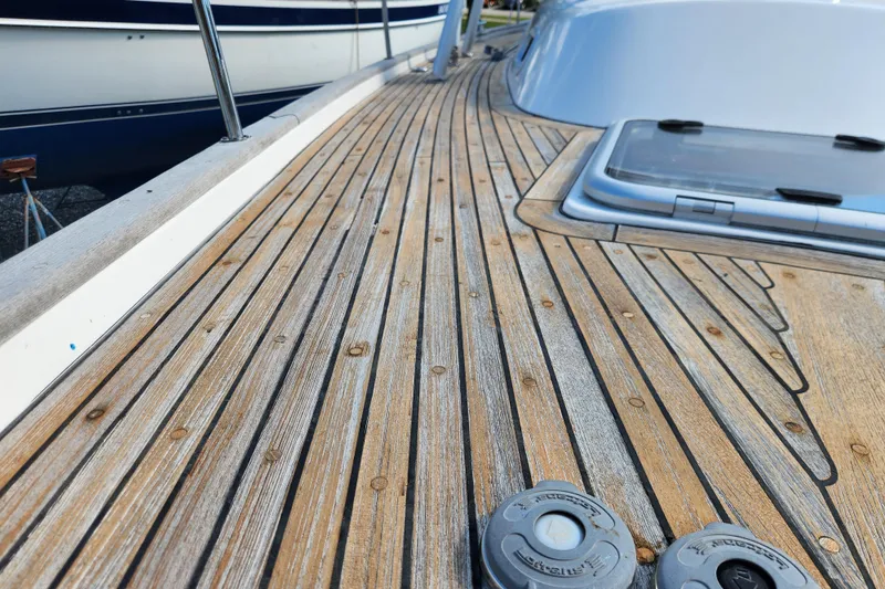 Slide: The Image of Teak deck of 2007 Hallberg-Rassy 37 sailboat, showcasing elegant wood grain and craftsmanship. - 10
