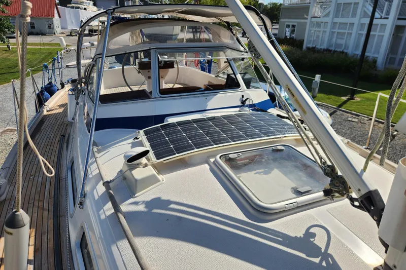 Slide: The Image of 2007 Hallberg-Rassy 37 sailboat with solar panel on deck, docked in marina. - 16