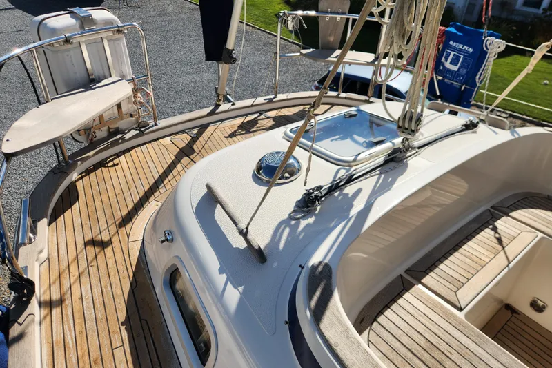 Slide: The Image of Deck view of a 2007 Hallberg-Rassy 37 sailboat with teak flooring and rigging. - 20