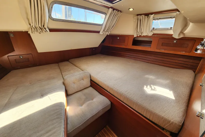 Slide: The Image of Luxurious cabin interior of a 2007 Hallberg-Rassy 37 yacht with cozy bedding. - 45