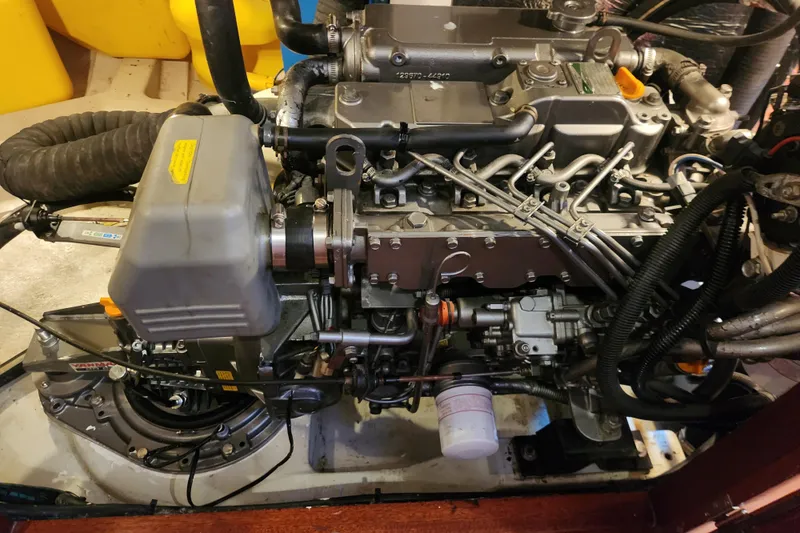 Slide: The Image of Engine of a 2007 Hallberg-Rassy 37 sailboat, showcasing intricate mechanical components. - 49