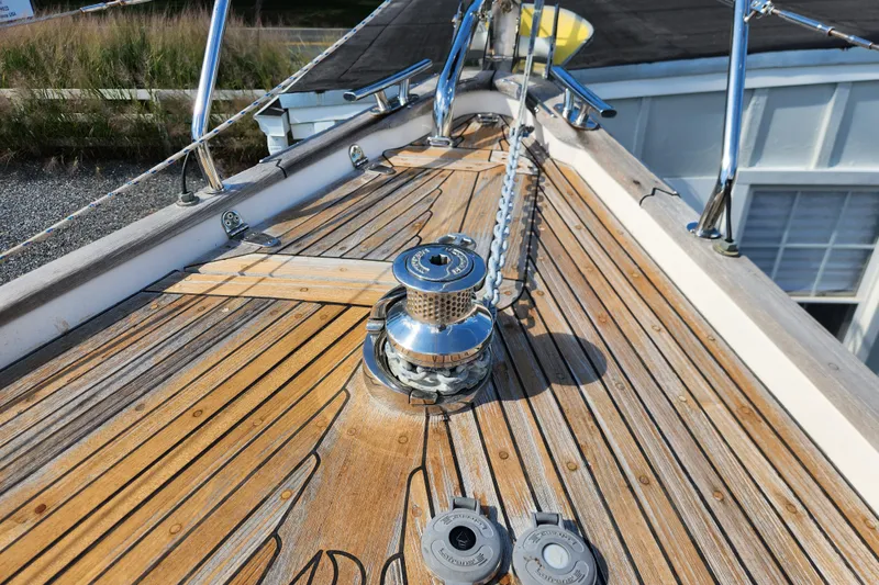 Slide: The Image of Deck of 2007 Hallberg-Rassy 37 sailboat with winch and teak wood finish. - 5