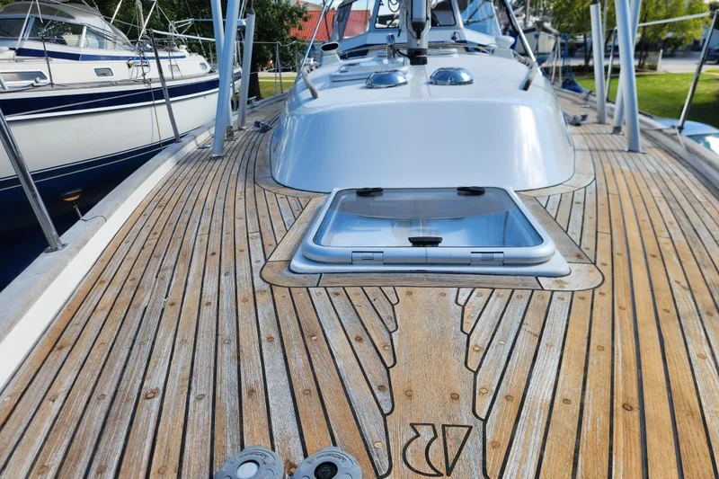 Slide: The Image of Deck view of a 2007 Hallberg-Rassy 37 sailboat with open hatch. - 8