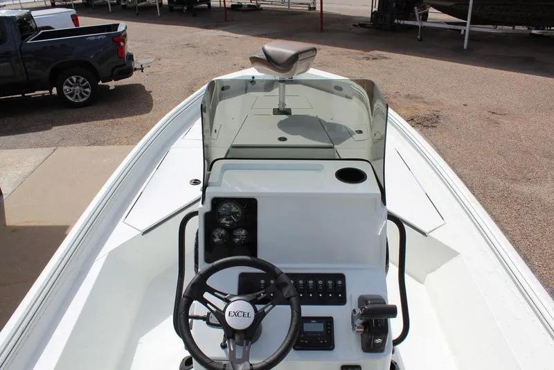 Slide: The Image of 2026 Excel Bay Pro Elite 230 boat console with steering wheel and controls. - 17